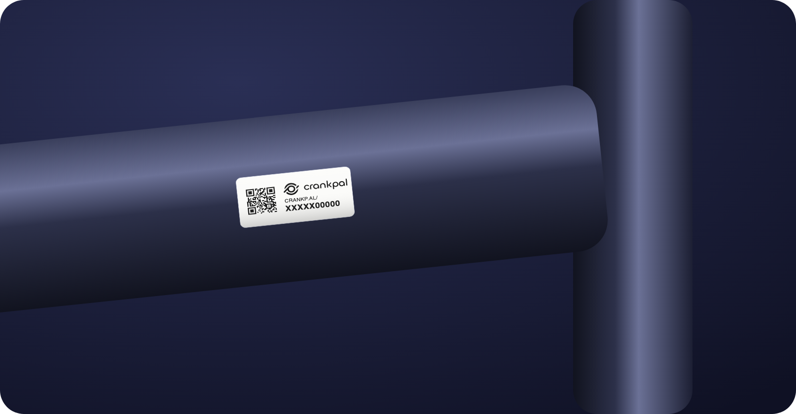 A CrankPal Tag stuck on the top tube of a dark frame, near the head tube.